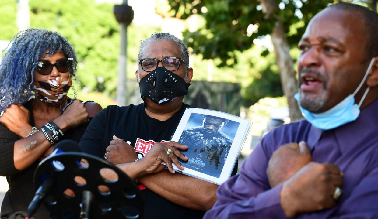 <span class="caption">A man holds a photograph of Chadwick Boseman, who died from colon cancer at age 43. </span> <span class="attribution"><a class="link " href="https://www.gettyimages.com/detail/news-photo/man-holds-a-photograph-of-the-late-us-actor-and-producer-news-photo/1228262421?adppopup=true" rel="nofollow noopener" target="_blank" data-ylk="slk:Frederic J. Brown/AFP/Getty Images;elm:context_link;itc:0;sec:content-canvas">Frederic J. Brown/AFP/Getty Images</a></span>