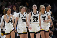 Iowa guard Caitlin Clark (22) reacts after making a three-point basket during the second half of a Final Four college basketball game against UConn in the women's NCAA Tournament, Friday, April 5, 2024, in Cleveland. (AP Photo/Carolyn Kaster)