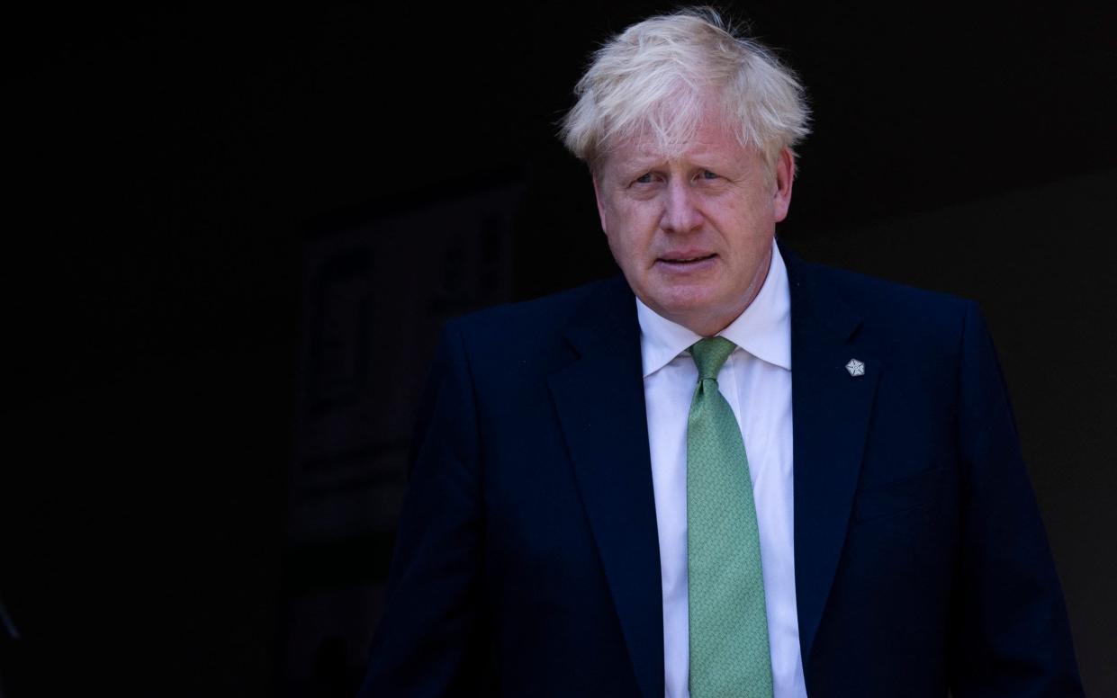 Boris Johnson was in Rwanda for the Commonwealth Heads of Government Meeting as the bruising by-election results came in. - DAN KITWOOD/AFP