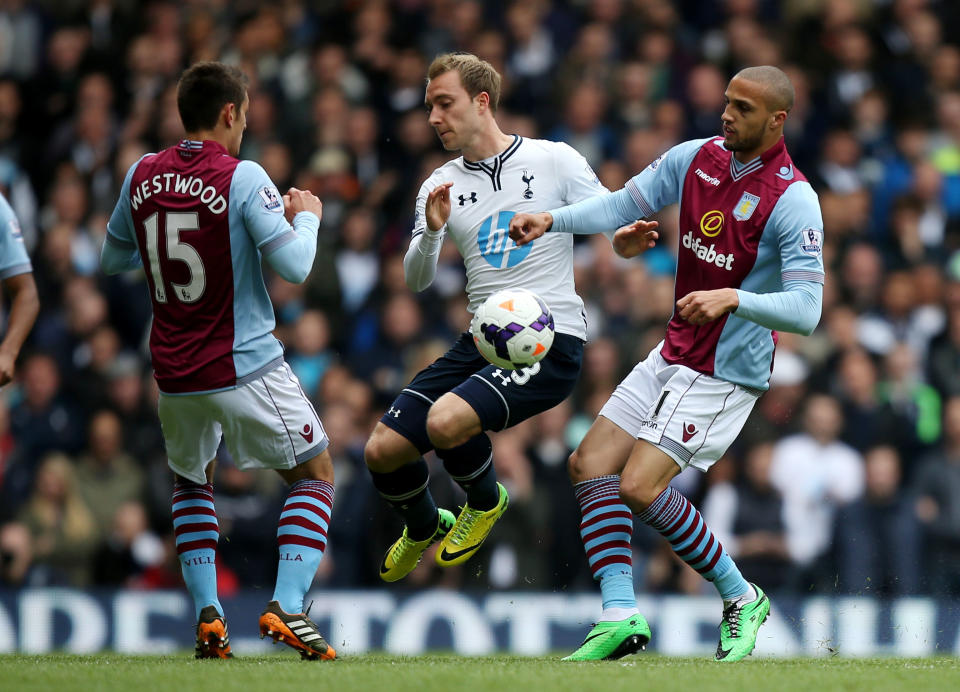 Tottenham Hotspur's Christian Eriksen, center, battles for the ball with Aston Villa's Jordan Bowery, right, and Ashley Westwood during the English Premier League soccer match at White Hart Lane, London, Sunday May 11, 2014. (AP Photo/PA, John Walton) UNITED KINGDOM OUT NO SALES NO ARCHIVE