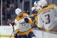 Nashville Predators left wing Jason Zucker (16) is congratulated for a goal against the Arizona Coyotes during the first period of an NHL hockey game Thursday, March 28, 2024, in Tempe, Ariz. (AP Photo/Rick Scuteri)