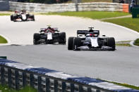 AlphaTauri's Russian driver Daniil Kvyat (front) steers his car during the Formula One Styrian Grand Prix race on July 12, 2020 in Spielberg, Austria. (Photo by Joe Klamar / various sources / AFP) (Photo by JOE KLAMAR/AFP via Getty Images)