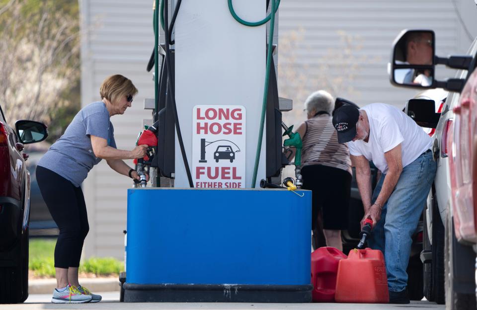 Customers pump gasoline at Costco, W162N9235 Pershing Ave., in Menomonee Falls. After gas prices hit an all-time record high, 
the per-gallon price has fallen slightly in recent days as the price of crude oil has fallen.