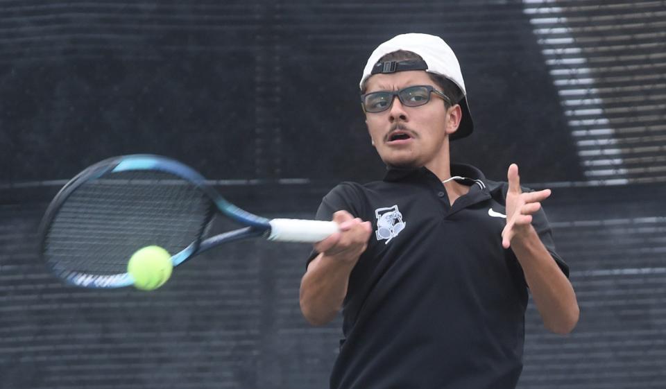 Abilene High's Victor Sotelo hits the ball during the boys doubles match against Abilene Wylie's Tate Heureman and Talan Baker. Sotelo and Garrison Scoggin beat the Wylie duo 7-6, 6-4, but Wylie won the District 4-5A team tennis match 15-4 on Oct. 3 at the AHS courts.
