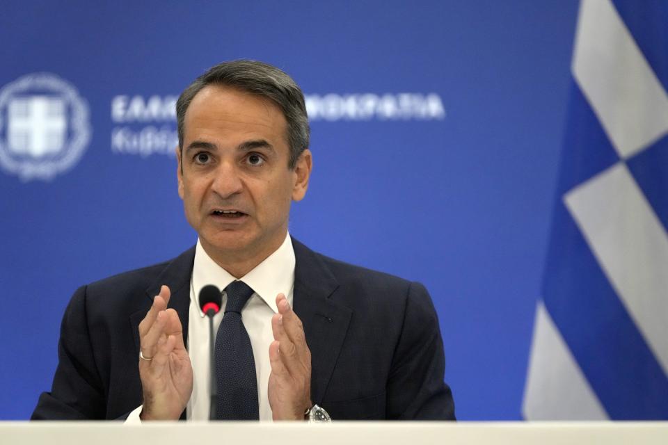 Greece's Prime Minister Kyriakos Mitsotakis speaks during a press conference in Athens, Thursday, Aug. 12, 2021. Mitsotakis says the devastating wildfires that burnt across the country over more than a week have caused the greatest ecological catastrophe Greece has seen in decades. (AP Photo/Thanassis Stavrakis)