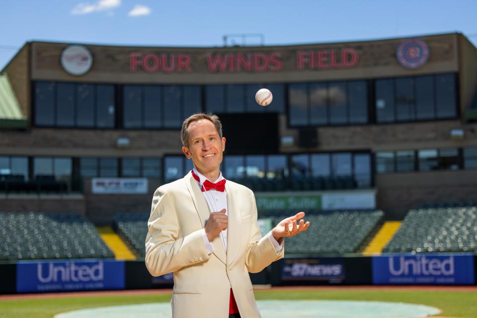 South Bend Symphony Orchestra Music Director Alastair Willis tosses a ball in the air at Four Winds Field at Coveleski Stadium, where he and the SBSO present "Symphony Under the Stars: American Anthems" on June 17, 2022.