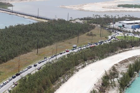 An aerial view shows cars lined up to cross a damaged bridge after hurricane Dorian hit the Grand Bahama Island in the Bahamas