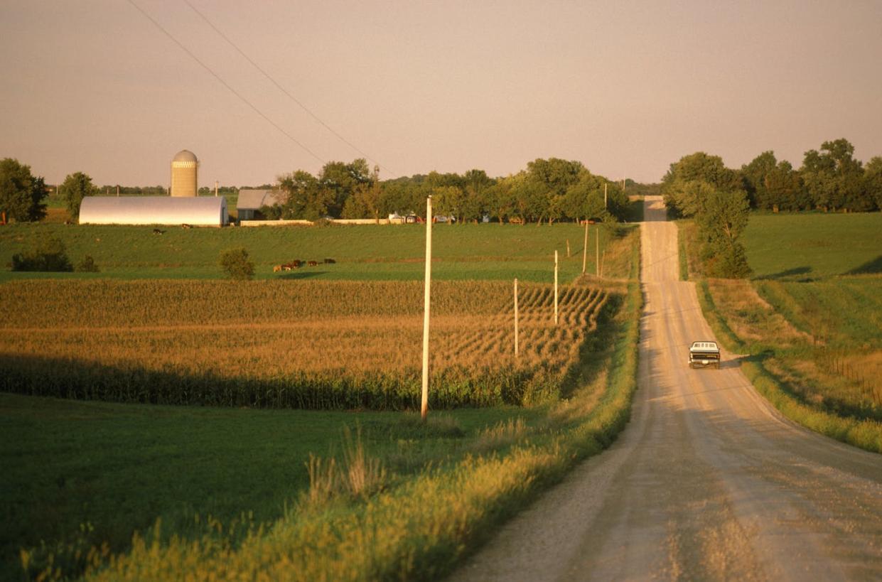 Broadband is noticeably missing in rural, remote or Indigenous areas. <a href="https://www.gettyimages.com/detail/photo/northern-minnesota-truck-on-gravel-road-rear-view-royalty-free-image/200348063-001?phrase=Rural+america&adppopup=true" rel="nofollow noopener" target="_blank" data-ylk="slk:Grant Faint/The Image Bank via Getty Images;elm:context_link;itc:0;sec:content-canvas" class="link ">Grant Faint/The Image Bank via Getty Images</a>