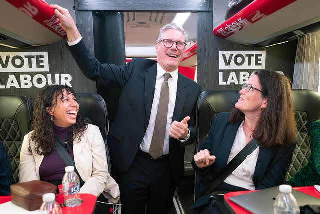 <p>Stefan Rousseau/PA Images/Getty</p> Labour Party leader Sir Keir Starmer talks to journalists on board his campaign bus on June 13, 2024