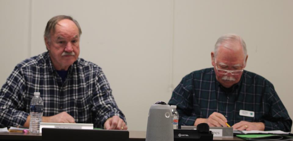 Emmet County commissioners Rich Ginop (left) and Don Mapes (right) attend the Feb. 7 health department board meeting. The board consists of eight members, two commissioners each from each Antrim, Charlevoix, Emmet and Otsego.