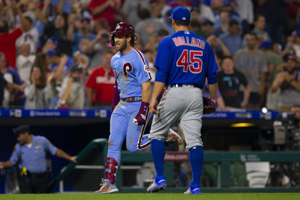 PHILADELPHIA, PA - AUGUST 15: Bryce Harper #3 of the Philadelphia Phillies reacts in front of Derek Holland #45 of the Chicago Cubs after hitting a walk-off grand slam at Citizens Bank Park on August 15, 2019 in Philadelphia, Pennsylvania. The Phillies defeated the Cubs 7-5. (Photo by Mitchell Leff/Getty Images)