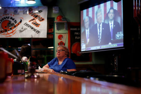 Carol Bumiller watches as President Donald Trump speaks to congress during a Pinellas County Republican Party watch party in Clearwater, Florida, U.S. February 28, 2017. REUTERS/Scott Audette