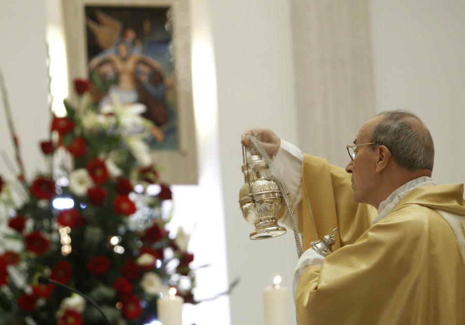 Cardinal Velasio De Paolis celebrates a mass in the Legion of Christ main headquarters, the Ateneo Pontificio Regina Apostolorum, in Rome, Tuesday, Feb. 25, 2014. Cardinal De Paolis celebrated his final Mass as papal delegate on Tuesday and was sent off with a round of applause from a congregation eager to take back the autonomy that was wrested away from it by Pope Benedict XVI in 2010. (AP Photo/Riccardo De Luca)