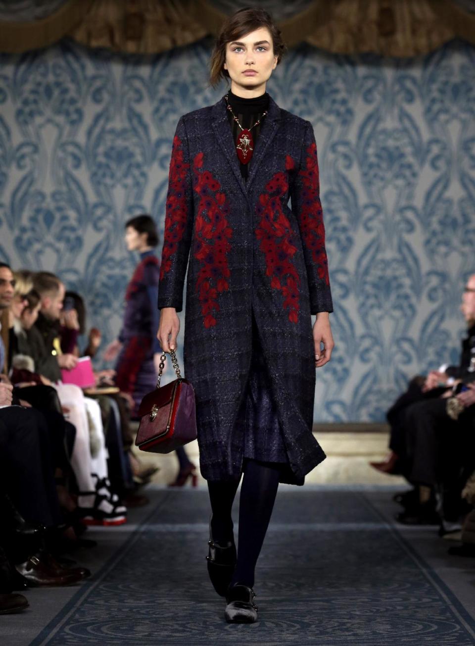 The Tory Burch Fall 2013 collection is modeled during Fashion Week in New York on Tuesday, Feb. 12, 2013. (AP Photo/Richard Drew)