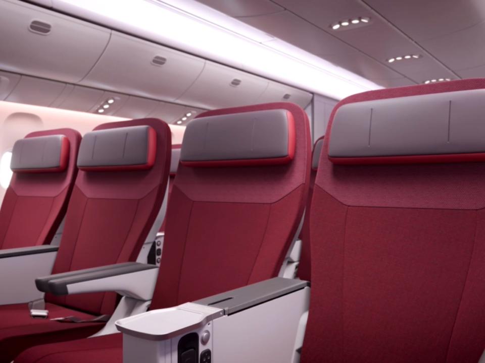 A set of four seats in the premium economy section.