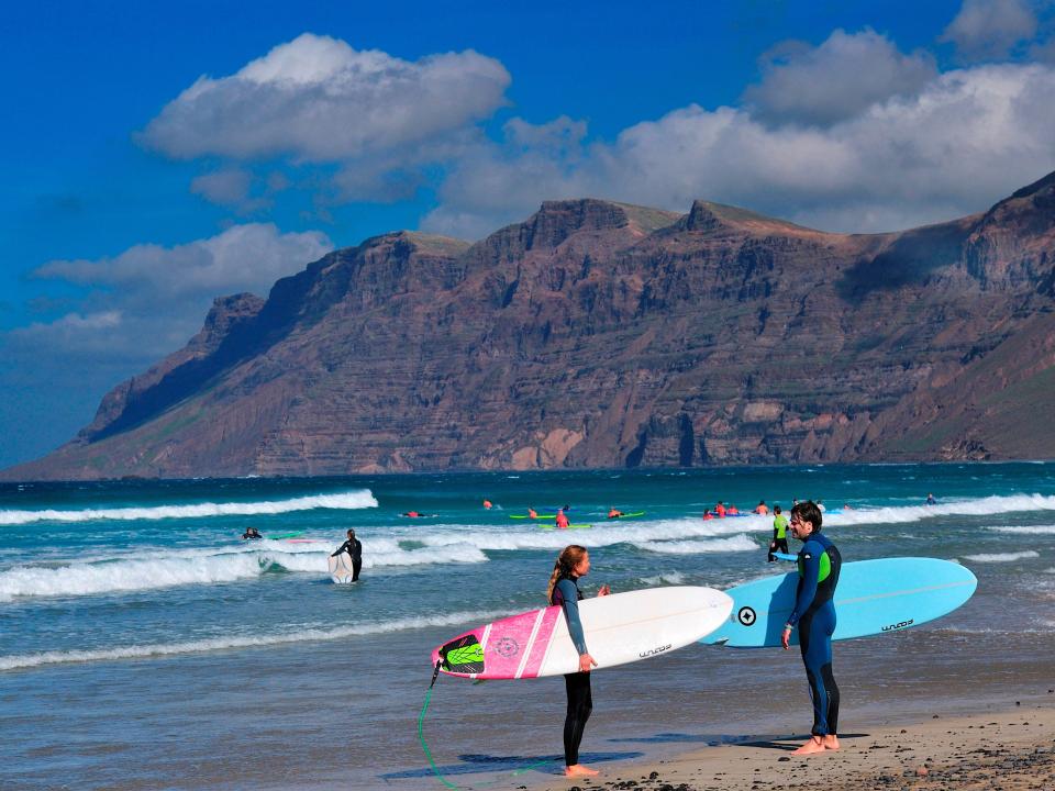 Surfing in Playa de Famara beach. Lanzarote north. Canary Islands. Spain. Europe.