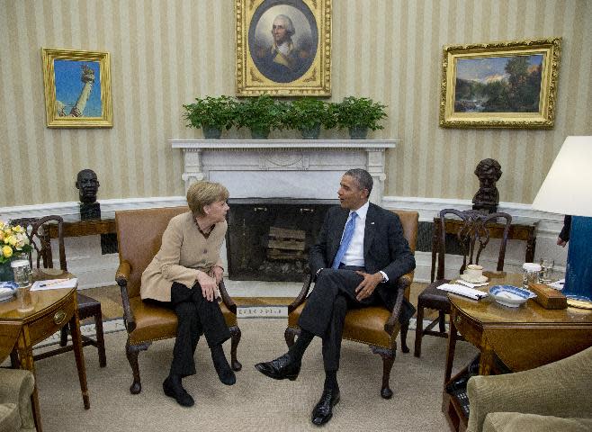 President Barack Obama meets with German Chancellor Angela Merkel in the Oval Office of the White House in Washington, Friday, May 2, 2014. Obama and Merkel are mounting a display of trans-Atlantic unity against an assertive Russia, even as sanctions imposed by Western allies seem to be doing little to change Russian President Vladimir Putin's reasoning on Ukraine. (AP Photo/Carolyn Kaster)