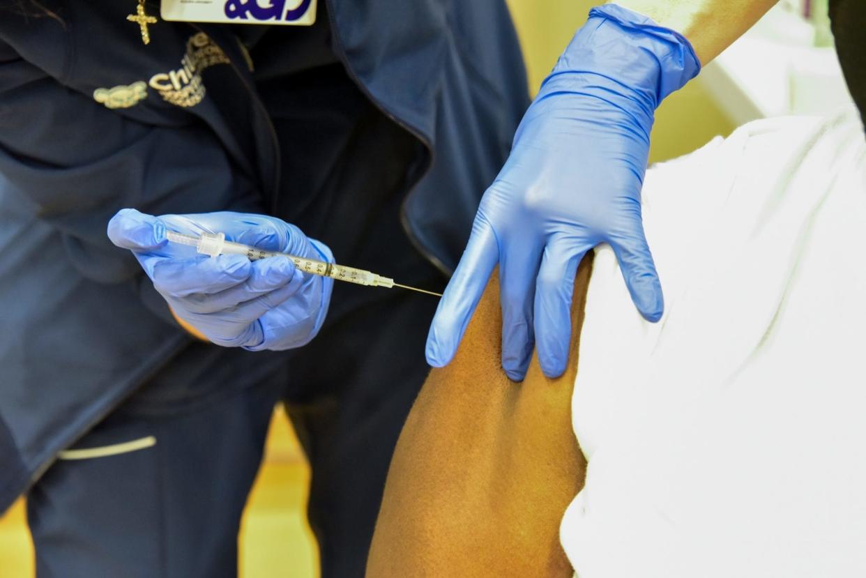 A nurse at AU Health System delivers a COVID-19 vaccine shot to a patient in this photo from 2021. AU recently received a $2.2 million gift to help fund its program that accelerates medical students' graduations so they can practice in rural areas.