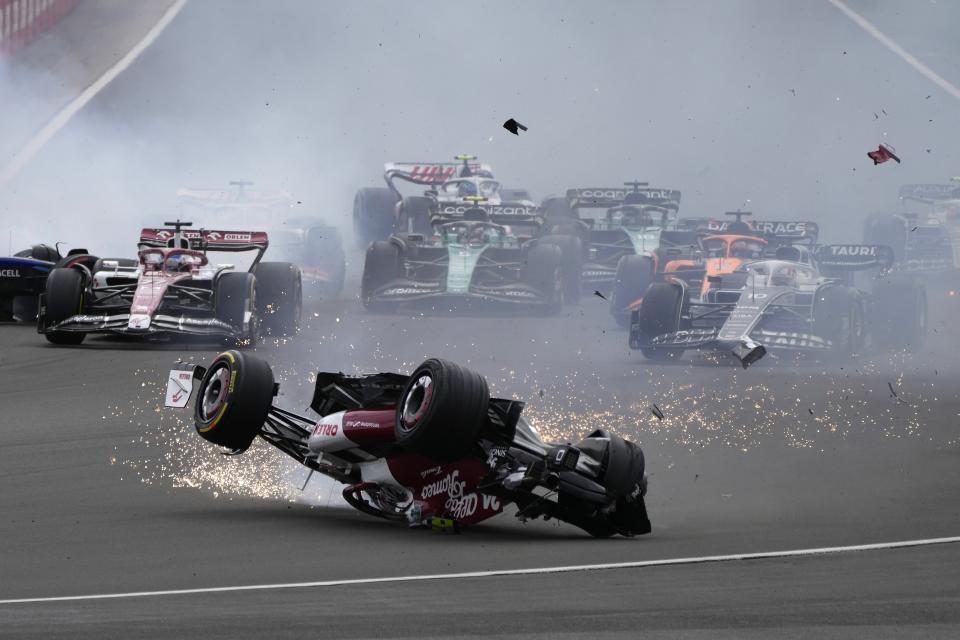 Alfa Romeo driver Guanyu Zhou of China crashes at the start of the British Formula One Grand Prix at the Silverstone circuit, in Silverstone, England, Sunday, July 3, 2022. (AP Photo/Frank Augstein)