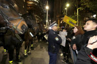 Protesters approach police on horseback as they gather in Sydney, Tuesday, June 2, 2020, to support the cause of U.S. protests over the death of George Floyd and urged their own governments to address racism and police violence. Floyd died last week after he was pinned to the pavement by a white police officer who put his knee on the handcuffed black man's neck until he stopped breathing. (AP Photo/Rick Rycroft)
