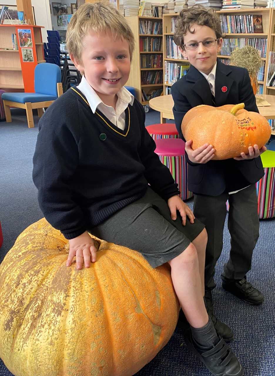 Seven-year-old Tasker Williams, from Usk, (left) with his whopping 79kg pumpkin and fellow Year 3 grower, Vincent Hanratty, who lives in ChepstowMonmouth School