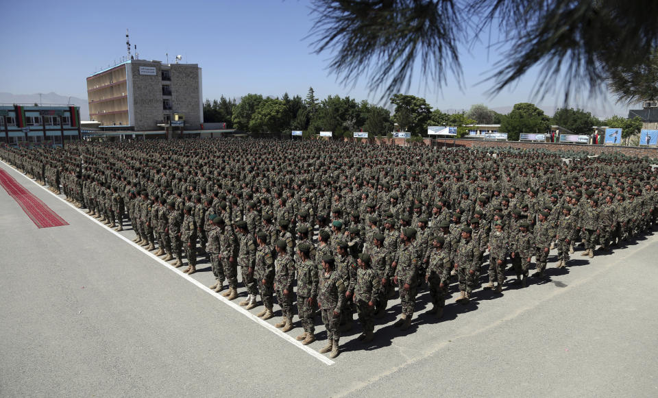 Afghan National Army soldiers attend their graduation ceremony from a 3-month training program at the Afghan Military Academy in Kabul, Afghanistan, Monday, May 27, 2019. (AP Photo/Rahmat Gul)