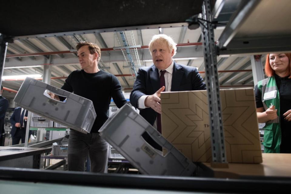 THG founder Matthew Moulding, left, with Prime Minister Boris Johnson (PA Archive)