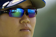 The sixth tee box is seen in the reflection of the sunglasses worn by Nasa Hataoka, of Japan, during the first round of the LPGA Tour Kroger Queen City Championship golf tournament in Cincinnati, Thursday, Sept. 8, 2022. (AP Photo/Aaron Doster)