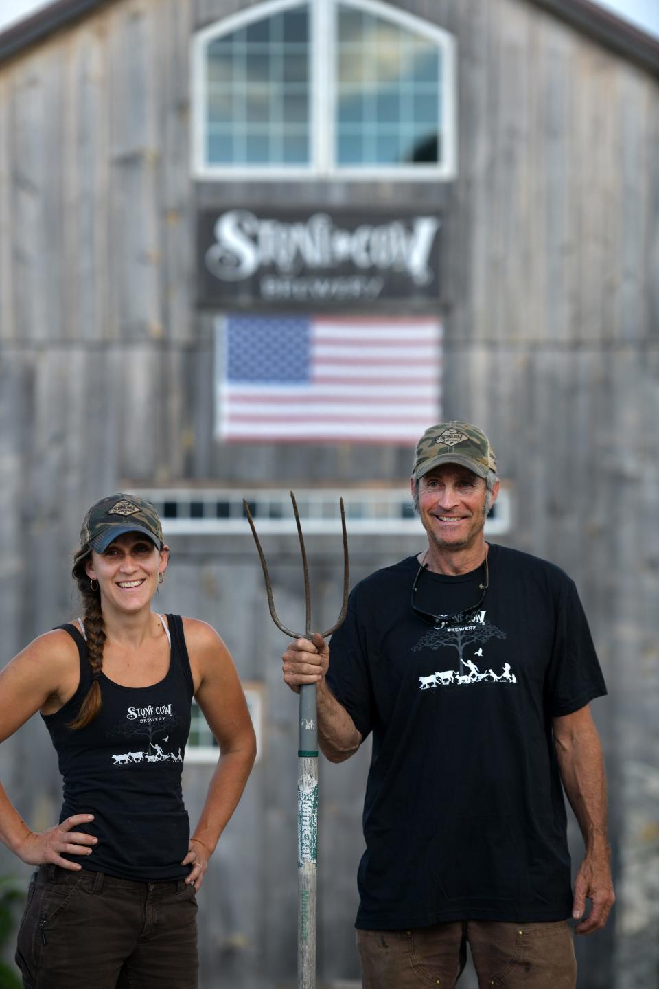 In a reprisal of the famous painting American Gothic, Molly Stevens Dubois and her father Phil Stevens put their own spin on the American classic at Stone Cow Brewery Tuesday, June 15, 2021.