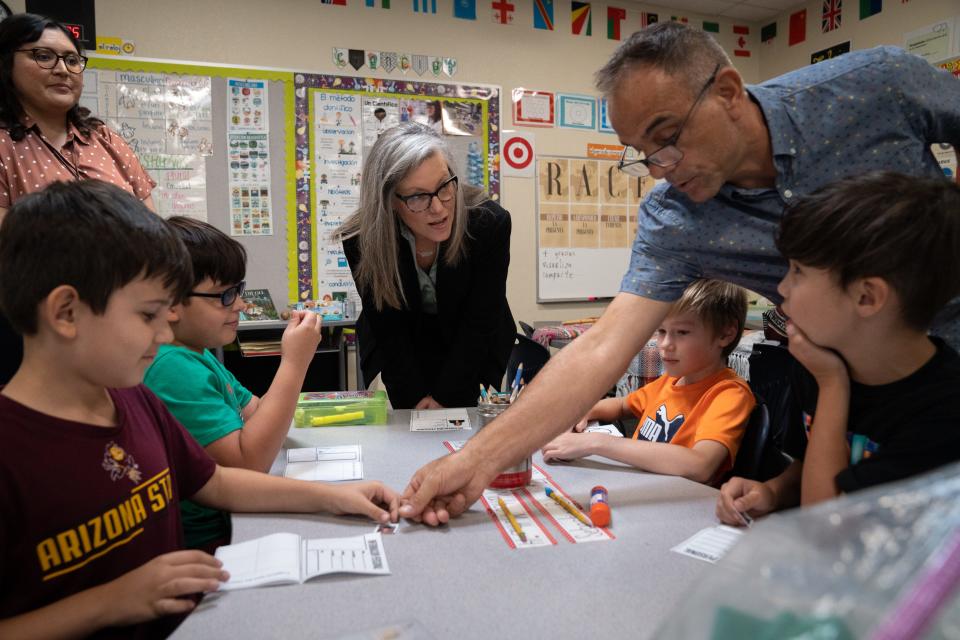 Gov. Katie Hobbs (center) talks with students in Diego Lopez (2nd from right, Dual Language Academy) third grade classroom, August 1, 2023, at Kyrene de los Lagos Elementary, 17001 S 34th Way, Phoenix, Arizona.