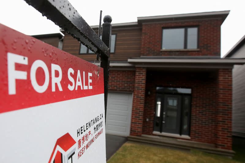 Houses are seen for sale and under construction in a neighbourhood of Ottawa