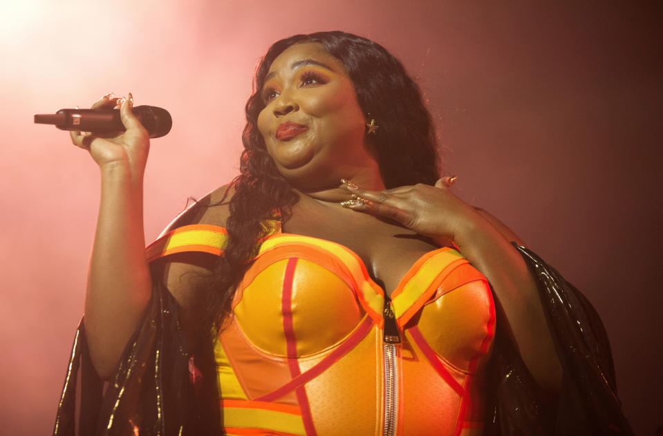 FILE - This Sept. 18, 2019 file photo shows Lizzo performing at The Met in Philadelphia. Mina Lioness’ longstanding battle to finally receive writing credit on Lizzo’s megahit song “Truth Hurts” is paying off in more ways than one: it could win her a potential Grammy Award. Lizzo's breakthrough tune features signature line that originated from a 2017 tweet by Lioness. (Photo by Owen Sweeney/Invision/AP, File)