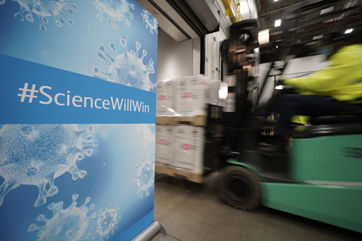 FILE - Boxes containing the Pfizer COVID-19 vaccine are loaded onto a truck for shipping at the Pfizer Global Supply Kalamazoo manufacturing plant in Portage, Mich., Dec. 13, 2020. The nation’s COVID-19 death toll stands at around 800,000 as the anniversary of the U.S. vaccine rollout arrives. A year ago it stood at 300,000. What might have been a time to celebrate a scientific achievement is fraught with discord and mourning. (AP Photo/Morry Gash, Pool, File)