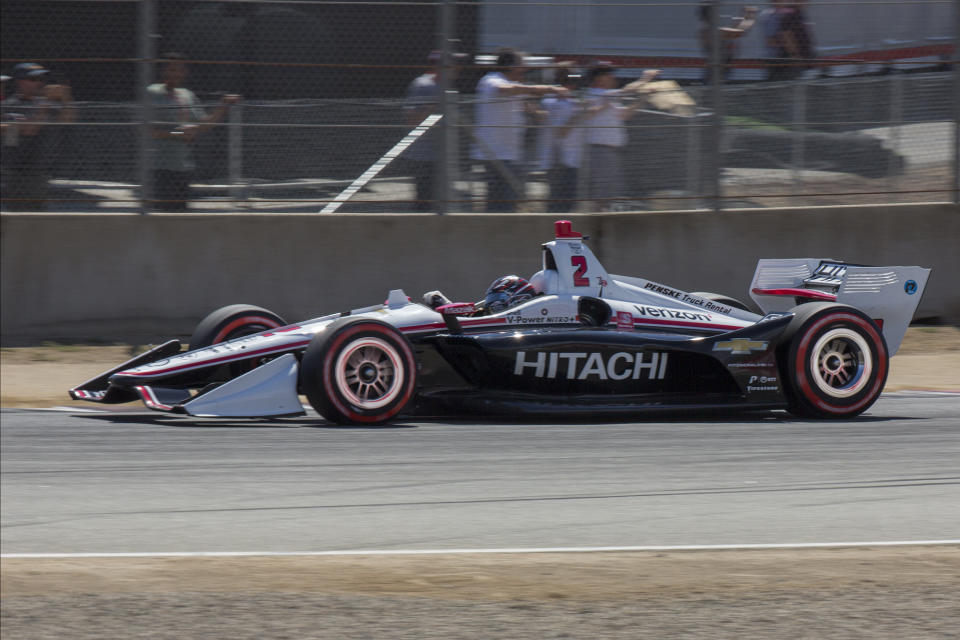 Josef Newgarden (2) races through Turn 3 during the start of an IndyCar auto race at Laguna Seca Raceway in Monterey, Calif., Sunday, Sept. 22, 2019. (AP Photo/David Royal)