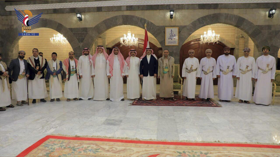 In this handout photo released on April 9, 2023 by the Houthi group’s media arm, Saudi, Yemen and Omani delegates pose for a photo in Sanaa, Yemen. The head of the Houthi’s supreme political council Mahdi al-Mashat , 11th from left and Saudi Arabia’s Ambassador to Yemen Mohammed bin Saeed Al-Jaber, 10th from left, in Sanaa, Yemen were among the delegates. Saudi officials were in Yemen's capital Sunday for talks with the Iran-backed Houthi rebels, as part of international efforts to find a settlement to Yemen’s nine-year conflict. (Ansar Allah Media Office)