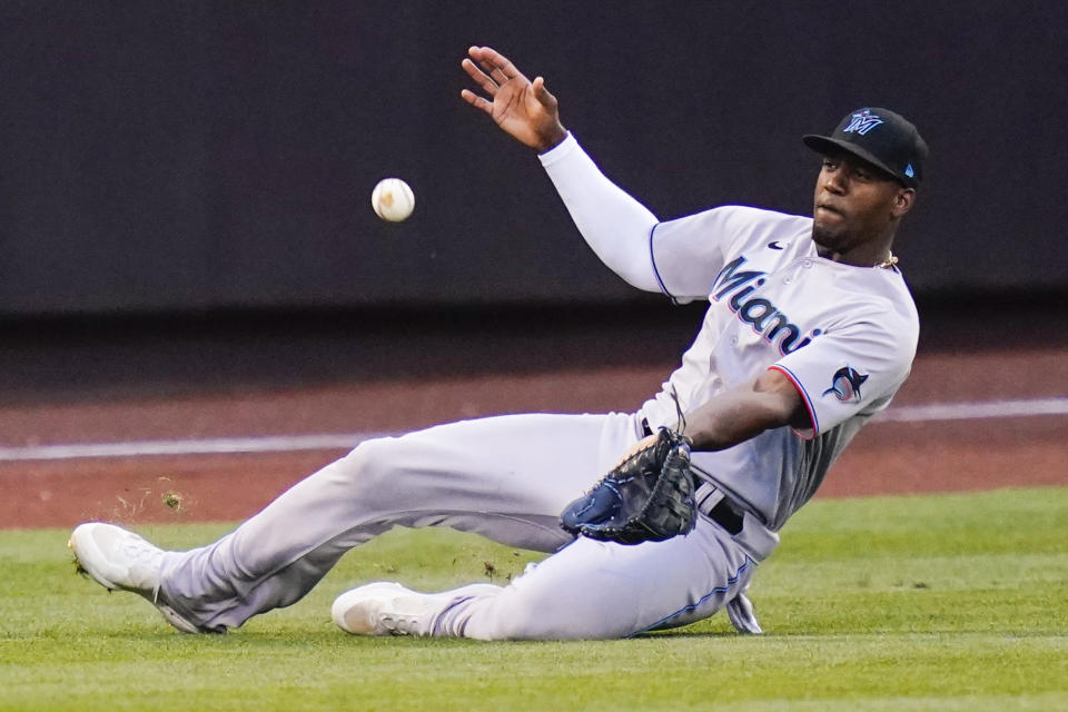 Miami Marlins' Jorge Soler catches a ball hit by New York Mets' Francisco Lindor for an out during the second inning of a baseball game Friday, June 17, 2022, in New York. (AP Photo/Frank Franklin II)