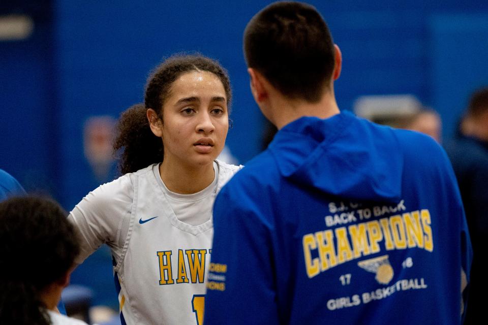 Devyn Quigley gets instruction from Coach Dave Beauchemin. Manchester Girls Basketball defeats Lacey in Manchester on January 24, 2023.