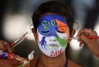 <p>An Indian college student, has her face painted with emblem of the Rio 2016 Summer Olympics, in Chennai on August 4, 2016, in an event to wish the Indian contingent good luck ahead of the Rio 2016 Summer Olympics which is scheduled to begin on August 5, 2016. </p>