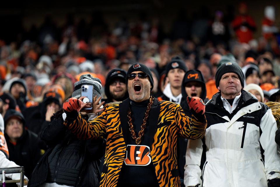 Cincinnati Bengals fans cheer in the fourth quarter Sunday night.