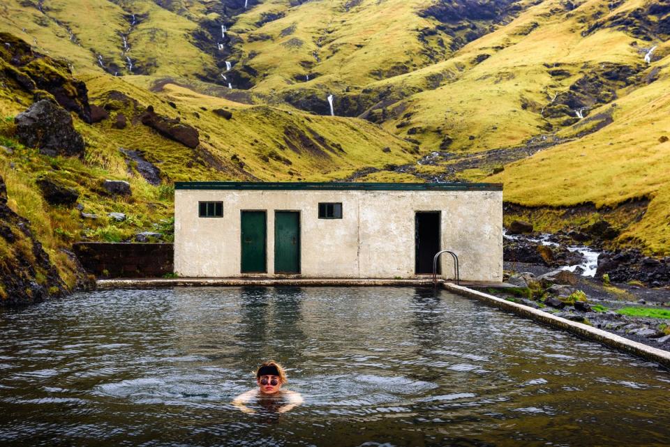 The 25m outdoor Seljavallalaug pool is a unique Northern Lights viewing point (Getty Images/iStockphoto)