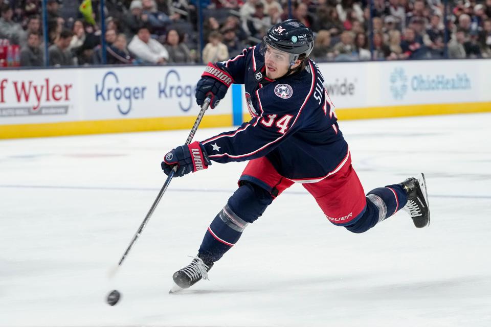 Oct 14, 2022; Columbus, Ohio, USA;  Columbus Blue Jackets center Cole Sillinger (34) takes a shot during the third period of the NHL hockey game against the Tampa Bay Lightning at Nationwide Arena. The Blue Jackets lost 5-2. Mandatory Credit: Adam Cairns-The Columbus Dispatch