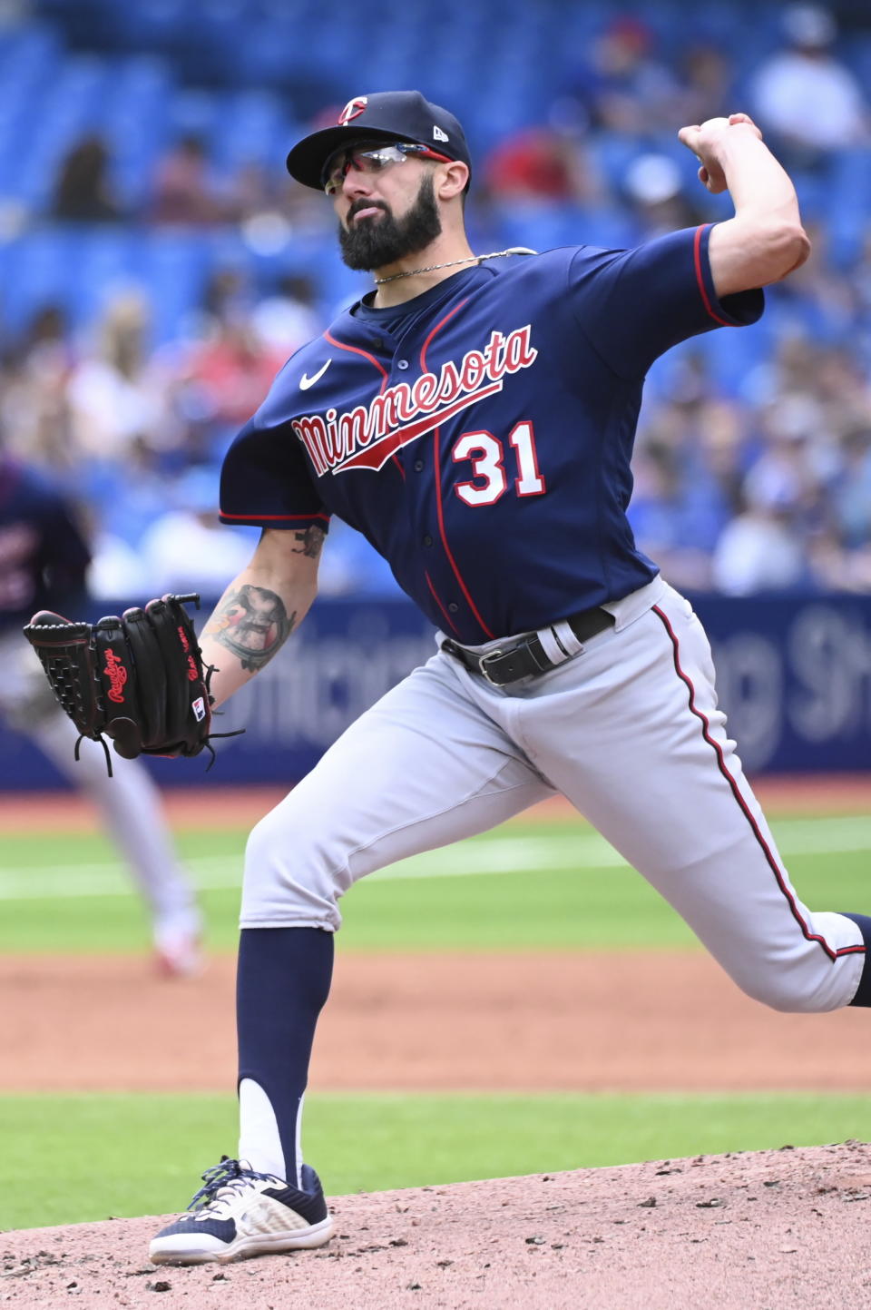 Minnesota Twins starting pitcher Devin Smeltzer (31) throws to a Toronto Blue Jays batter in the first inning of a baseball game in Toronto, Sunday, June 5, 2022. (Jon Blacker/The Canadian Press via AP)