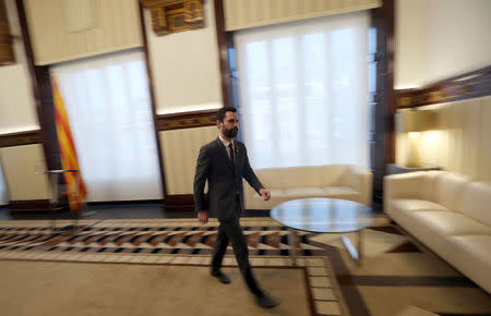 Roger Torrent, Speaker of Catalan regional Parliament, leaves after he delivers a statement in Barcelona, Spain, March 21, 2018. REUTERS/Albert Gea