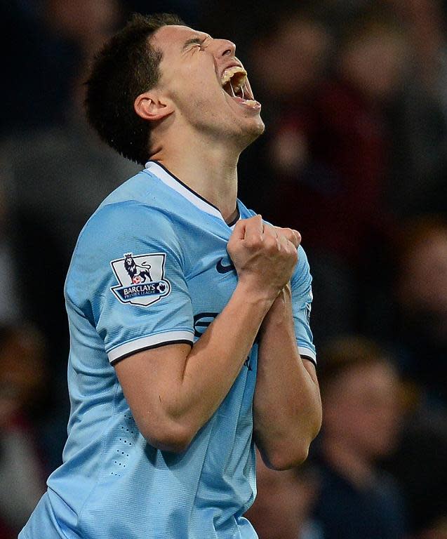 Manchester City's French midfielder Samir Nasri reacts after missing a chance at goal at the Etihad Stadium in Manchester on April 16, 2014