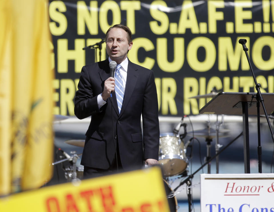 Republican gubernatorial candidate Rob Astorino speaks during a gun rights rally at the Empire State Plaza on Tuesday, April 1, 2014, in Albany, N.Y. Activists are seeking a repeal of a 2013 state law that outlawed the sales of some popular guns like the AR-15. The law championed by Gov. Andrew Cuomo has been criticized as unconstitutional by some gun rights activists. (AP Photo/Mike Groll)