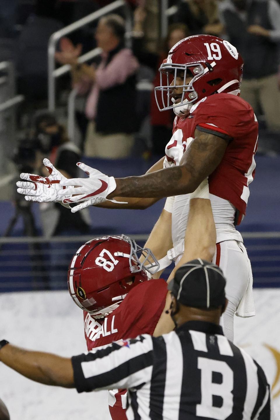 Alabama tight end Miller Forristall (87) and tight end Jahleel Billingsley (19) celebrate Billingsley's touchdown catch in the first half of the Rose Bowl NCAA college football game against Notre Dame in Arlington, Texas, Friday, Jan. 1, 2021. (AP Photo/Michael Ainsworth)