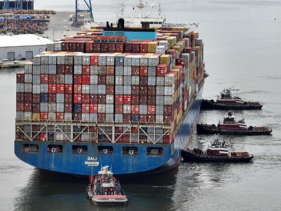 PHOTO: Tugboats maneuver the damaged container ship Dali through the Port of Baltimore and into the Seagirt Marine Terminal, May 20, 2024, in Baltimore, Md.  (Chip Somodevilla/Getty Images)