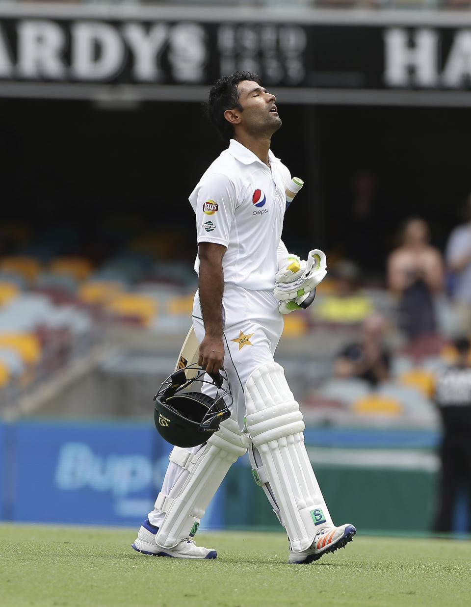 Pakistan's Asad Shafiq walks off after he lost his wicket during play on the final day of the first cricket test between Australia and Pakistan in Brisbane, Australia, Monday, Dec. 19, 2016. (AP Photo/Tertius Pickard)
