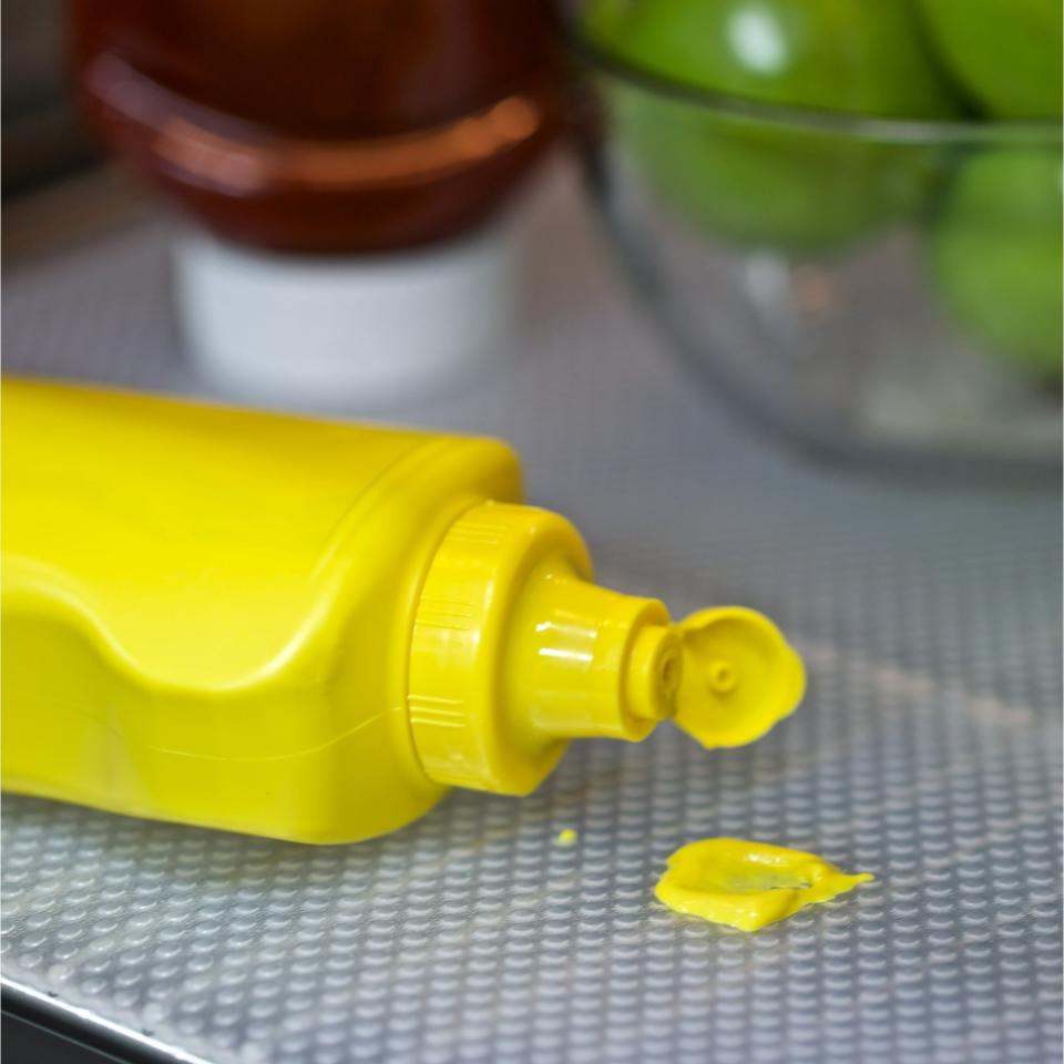 a mustard spill on the shelf liner