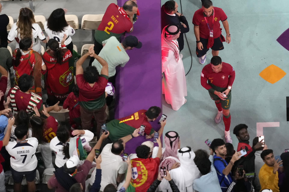 Portugal's Cristiano Ronaldo walks out from the pitch after the World Cup round of 16 soccer match between Portugal and Switzerland, at the Lusail Stadium in Lusail, Qatar, Tuesday, Dec. 6, 2022. Portugal defeated Switzerland 6-1. (AP Photo/Thanassis Stavrakis)